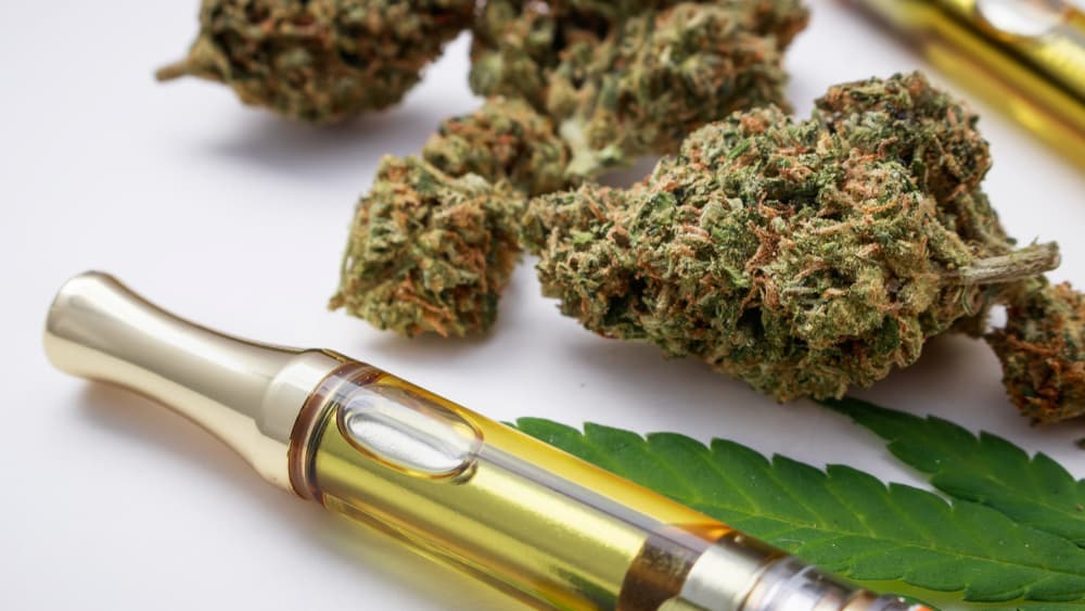 close up image of cannabis flower and weed pen